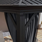Gazebo corner post with dark grey curtain panel and tie strap beneath the hardtop