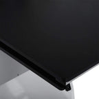 Black tabletop corner with sturdy legs and protective edge trim