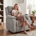 Light grey upholstered power recliner armchair with side remote and open leg support