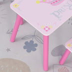Close-up of pink-legged kids table with princess crown print on the white tabletop