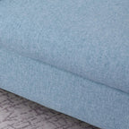 Close-up of blue upholstered armchair cushion fabric and seam detail