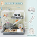 White wire hamster activity cage with tunnel, hut, ramp, and exercise wheel.