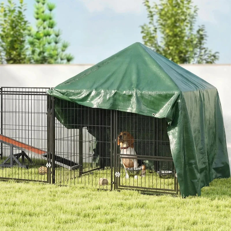 Green waterproof tarpaulin shelter over outdoor dog kennel with tie points