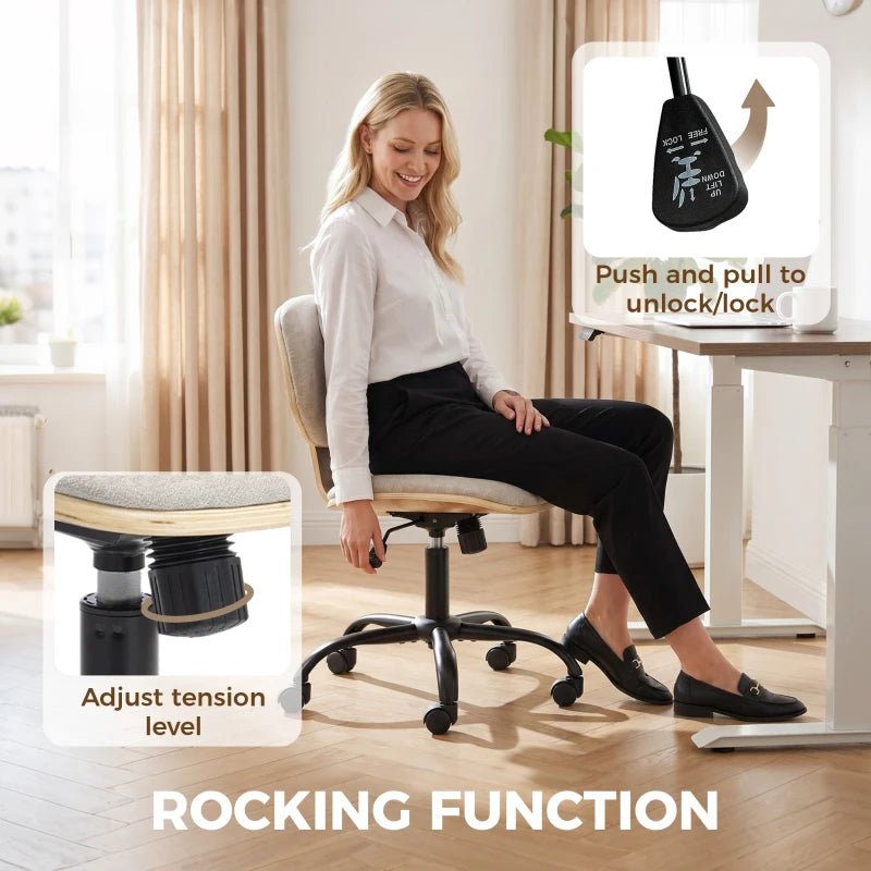 Light grey office chair with adjustable tension level, shown rocking function in use.