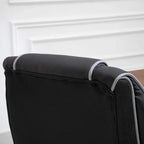 Close-up of black faux leather armrest with white trim and textured side panel