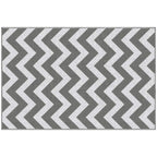 Flat reversible rug mat with light grey and white zigzag chevron pattern