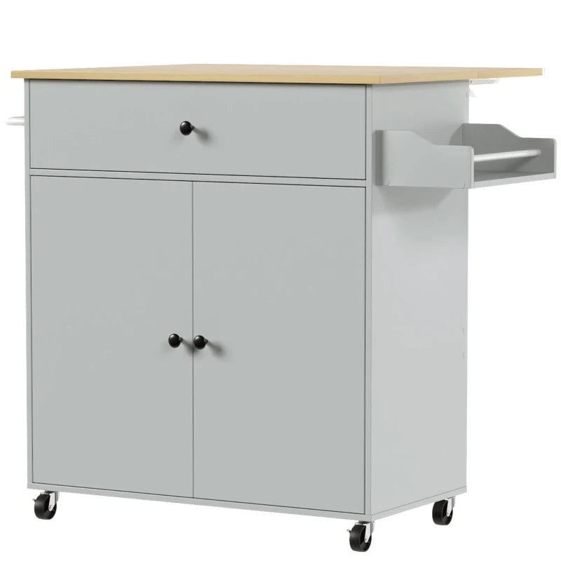 Grey rolling kitchen island cart with drawer, cabinet doors, and side shelf on wheels