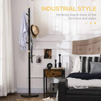 Freestanding coat rack stand with dark frame, gold bands, round base, and hanging coat