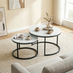Round marble-effect nesting table set with white tops and black metal ring bases