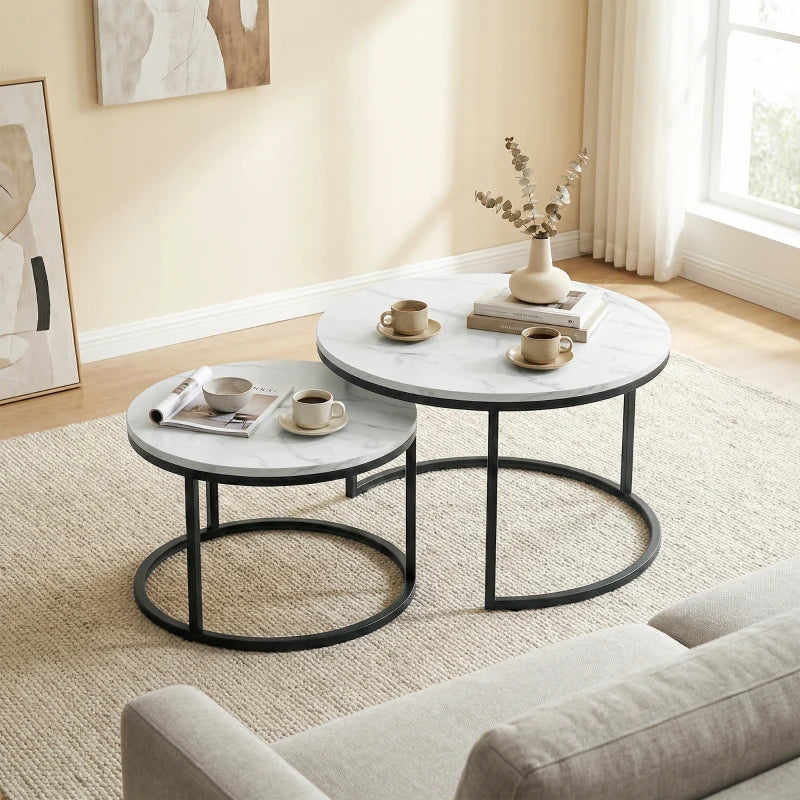 Round marble-effect nesting table set with white tops and black metal ring bases