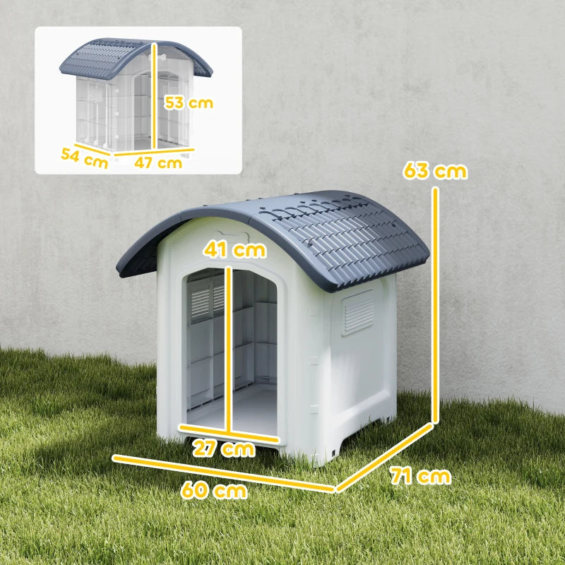 Outdoor plastic dog house in dark grey and white with slanted roof and open entrance