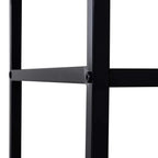 Black metal leg and crossbar detail on rustic brown TV stand