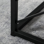 Close-up of black metal table leg base with corner bracket and screws