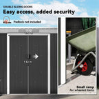 Dark grey metal shed with double sliding doors open, inner storage bay view