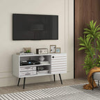 White TV console with striped door, open shelves, and dark legs in a living room.
