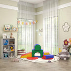 White kids toy storage cabinet beside play area, showing animal-print drawers and open shelves