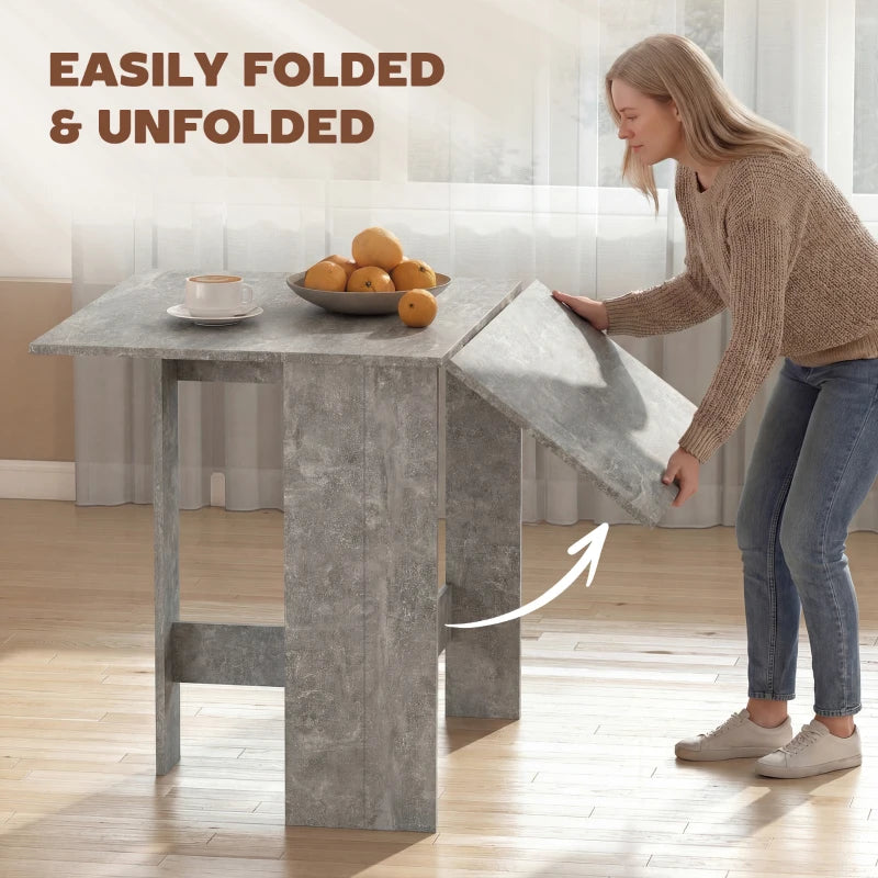 Grey drop-leaf dining table with one side leaf open for serving
