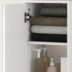 White tall cabinet interior with rolled towels and bathroom toiletries bottles