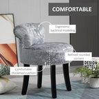 Grey velvet vanity stool with curved backrest, rounded corners, studded base, black legs