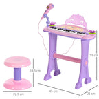 Pink mini electronic keyboard with adjustable microphone and matching stool, size shown