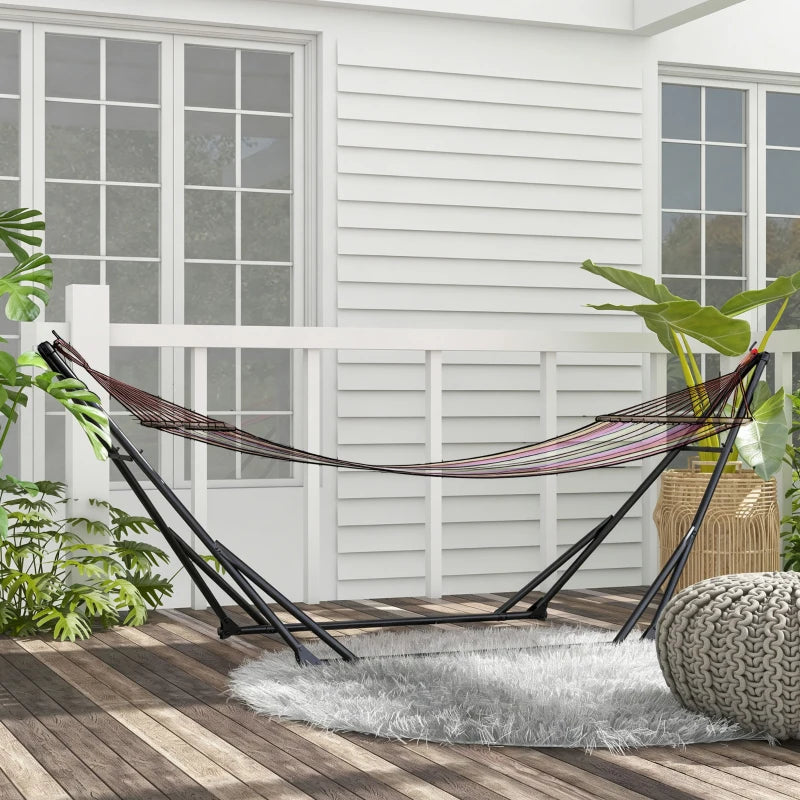 Black hammock stand with striped hammock net and wooden deck base