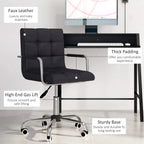Black faux leather padded desk chair with height-adjust gas lift and sturdy chrome base