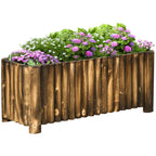 Wooden raised garden bed planter with purple and green flowers along the front edge.