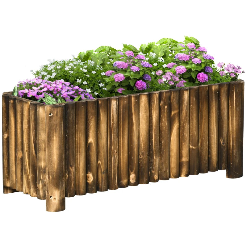 Wooden raised garden bed planter with purple and green flowers along the front edge.