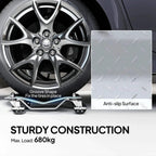 Metal wheel dolly anti-slip plate surface with grip grooves and swivel base.
