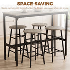 Grey bar table set with four stools tucked under the table, black metal frames