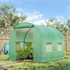 Green greenhouse polytunnel in outdoor garden, front door and side panels visible
