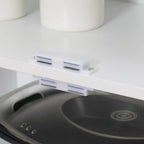 White cabinet shelf hardware with metal support rails and peg holes