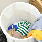 White laundry bin filled with folded clothes and a blue item near the top