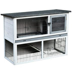 Two-level small animal hutch with grey roof, white frame, wire cage doors, open side view