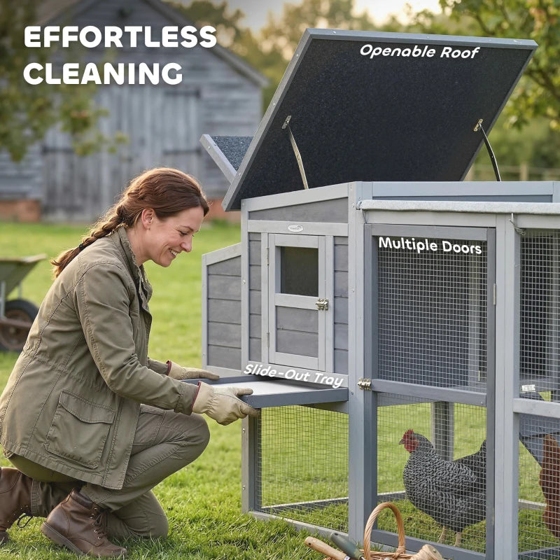 Grey wooden chicken coop with openable asphalt roof and slide-out tray