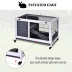 Elevated grey and white animal hutch with wire enclosure, lift-top, caster wheels
