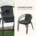 Black stackable rattan armchairs with curved frames and woven seat backs