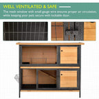 Two-level pet hutch with wire mesh ventilation and wooden front doors