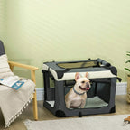 Grey foldable pet carrier with cushion, mesh side panels, shown with a small dog