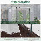 White greenhouse with potted plants, wind ropes, and mesh side walls