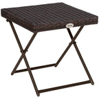 Brown folding rattan coffee table with woven top and X-frame legs