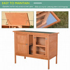 Wooden elevated pet hutch with openable roof and front mesh doors, green roof