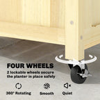 Wooden raised planter box with four swiveling lockable wheels and black caster brackets