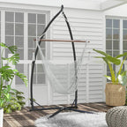 Black hammock chair stand holding a woven hammock chair suspended by metal chains