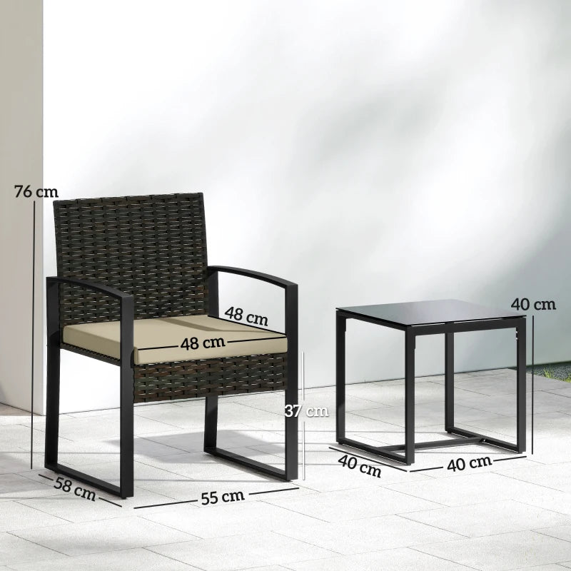 Outdoor rattan bistro set with two dark wicker armchairs and a glass-top side table