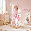 White plush unicorn rocking horse with pink mane, horn, and curved wooden rockers