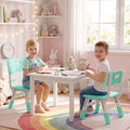 Green kids desk chairs with backrest, two children seated at a table