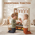 Children pretending to shop at a wooden play shop with striped awning and cash register