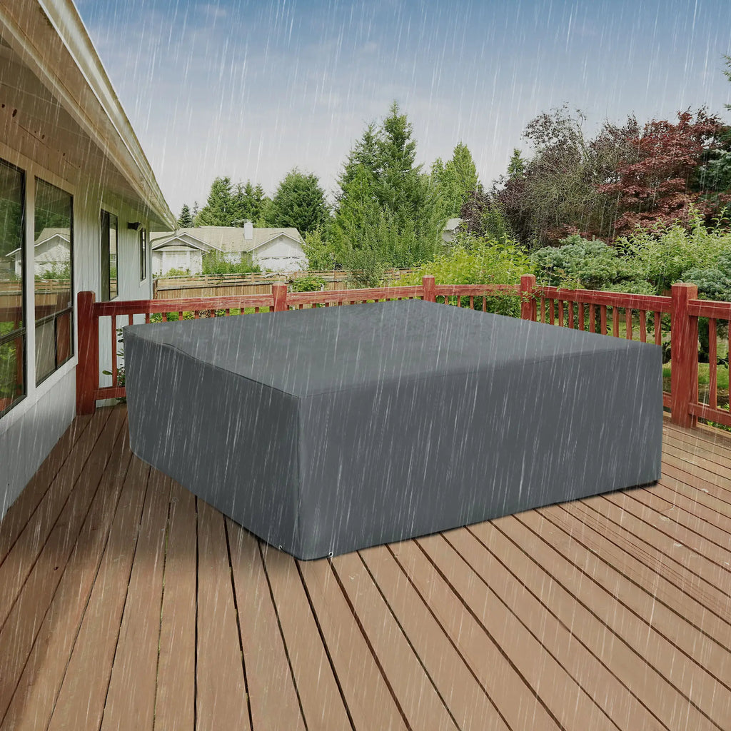 Gray outdoor furniture cover shown protecting furniture in the rain