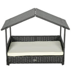 Dark rattan-style dog house bed with open front and cream cushion
